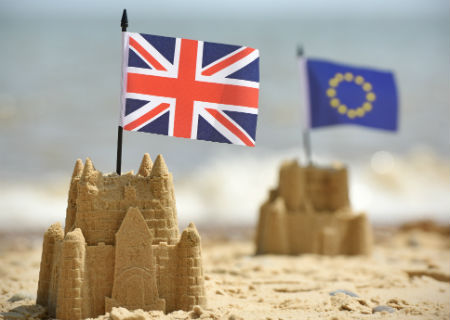 Union Jack and Euro flags in sand castles