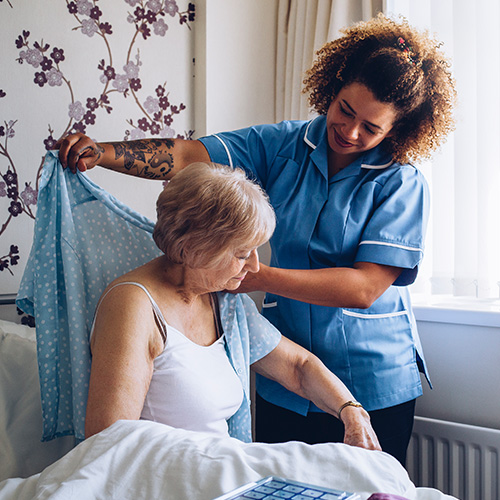 Woman being looked after in a care home