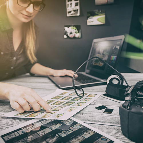 Photographer looking through pictures