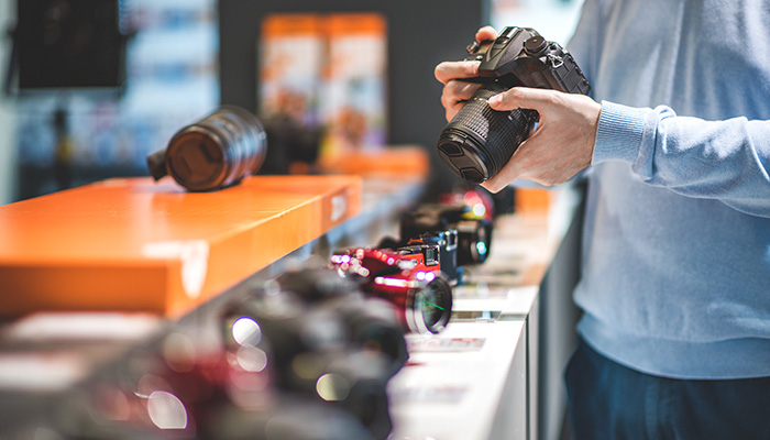 Photographer looking at cameras