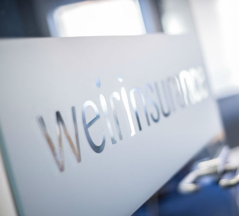 Weir Insurance sign on a door