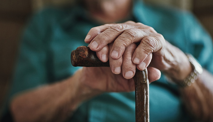Woman holding a cane