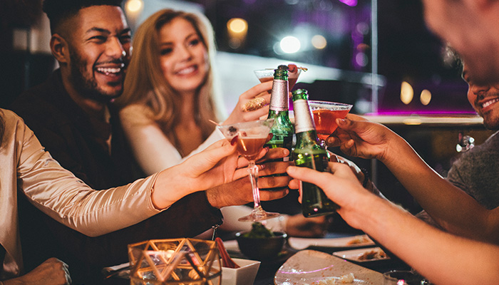 Friends clinking drinks