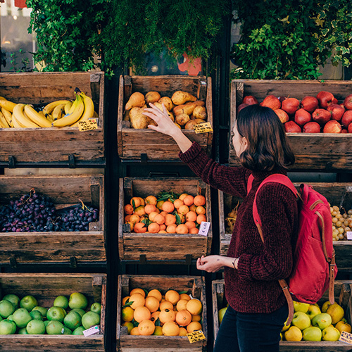 Woman looking at fruit