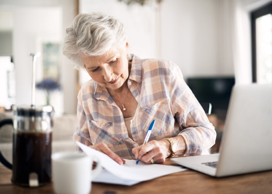 Woman writing at desk